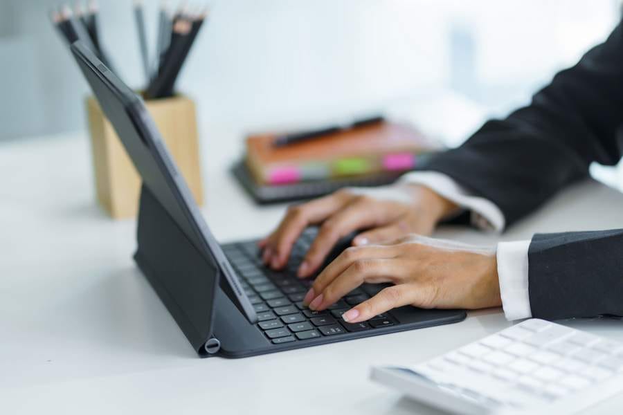 Close up. Woman hand working on a laptop keyboard.